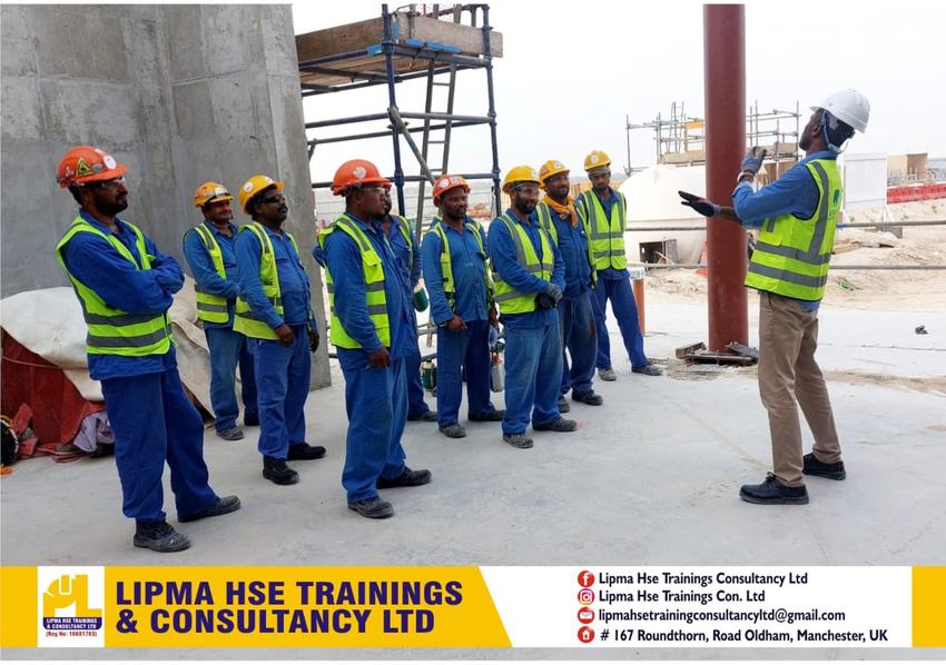 Linus Igbaofo delivering safety training in front of a whiteboard and presentation screen
